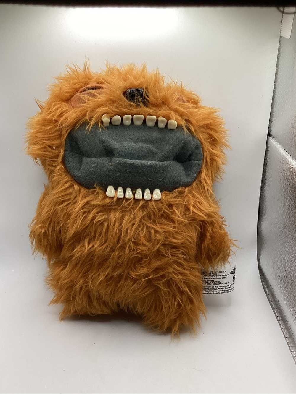 Fuggler Fart Face Battery Operated Fuzzy Orange Monster Plush with Toothy Mouth
